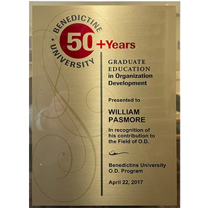 Golden plaque commemorating over 50 years of service at benedictine university presented to an individual for contributions to organization development - dated april 22, 2017.